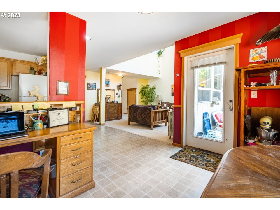 15469 Southwest Bygones Court Beaverton, OR 97007 - Photo 10 of 32 a living room with furniture and a window