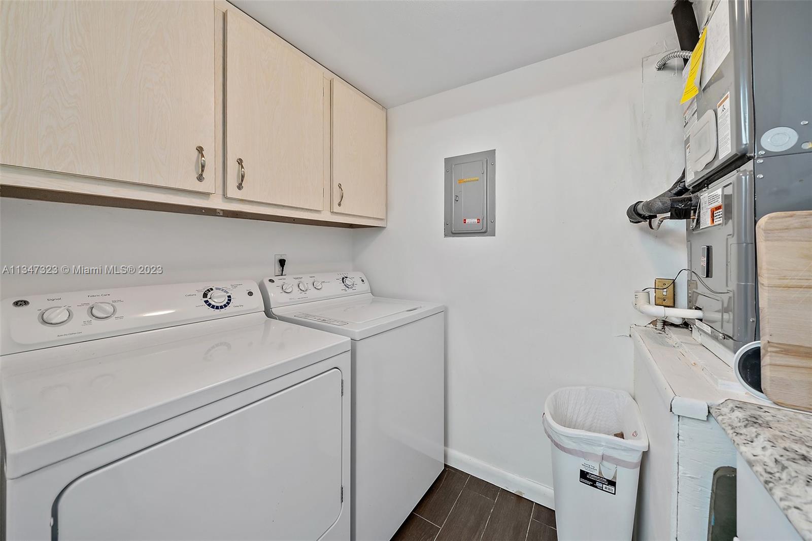 301 Pine Ridge Circle, Unit D2 Greenacres, FL 33463 - Photo 14 of 38 a utility room with dryer and washer