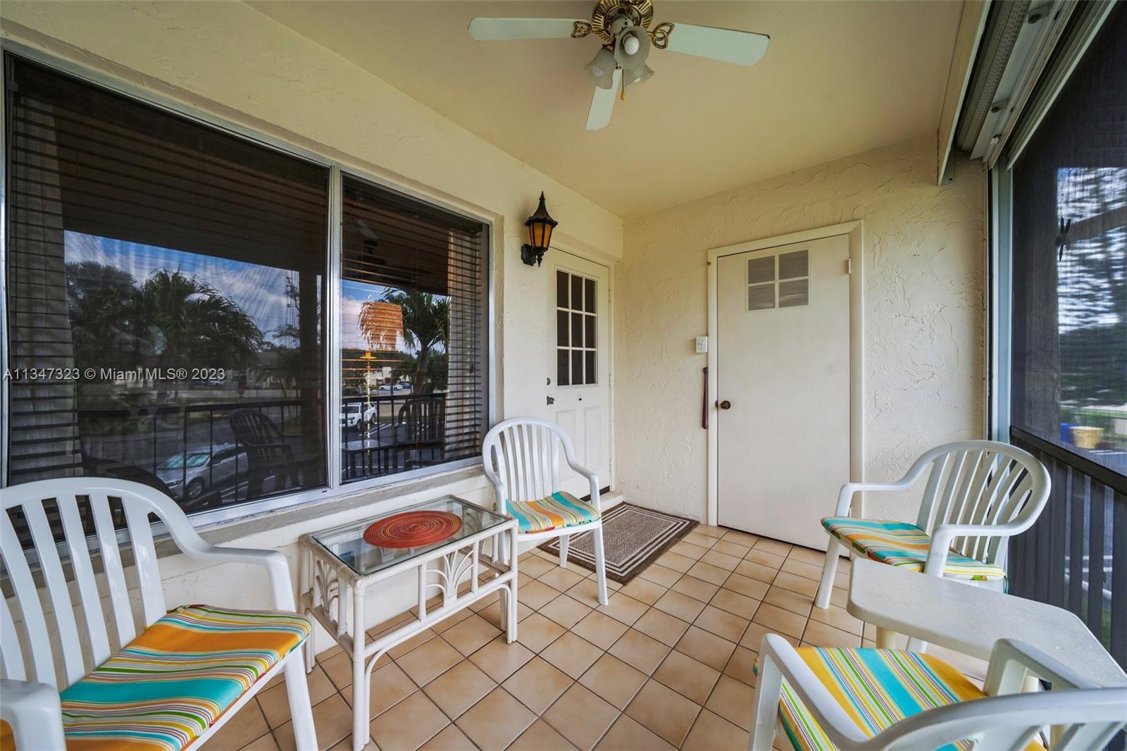301 Pine Ridge Circle, Unit D2 Greenacres, FL 33463 - Photo 3 of 38 a living room with furniture and a large window