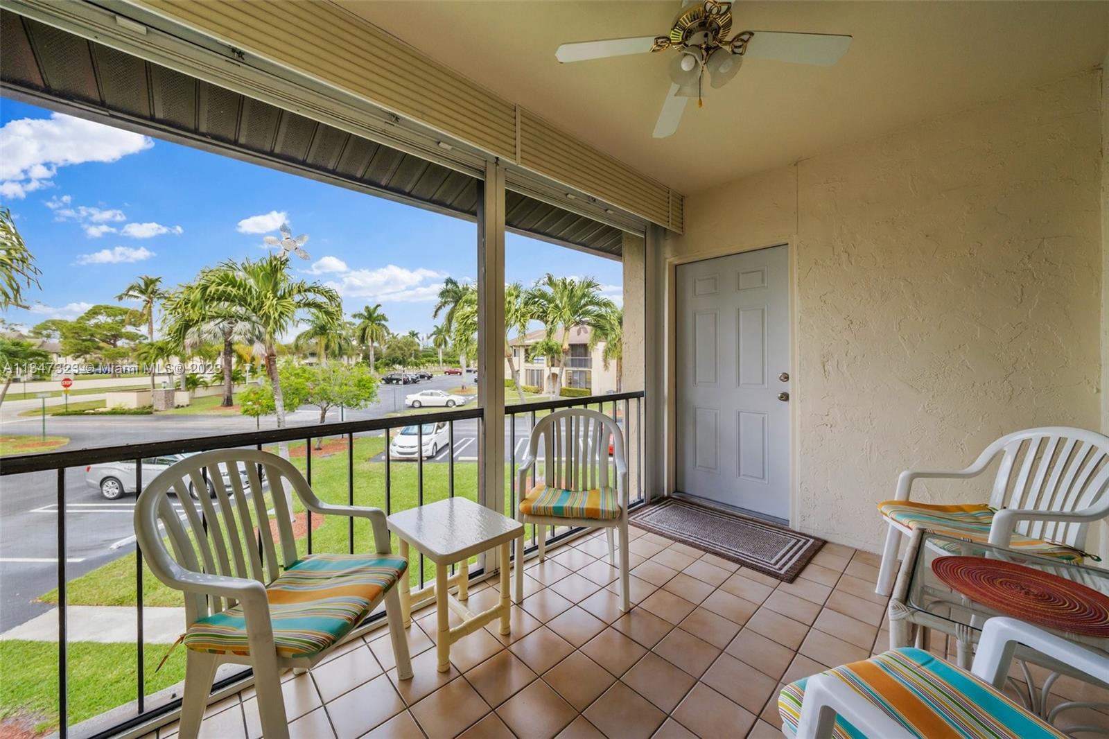 301 Pine Ridge Circle, Unit D2 Greenacres, FL 33463 - Photo 5 of 38 a view of a chairs in balcony