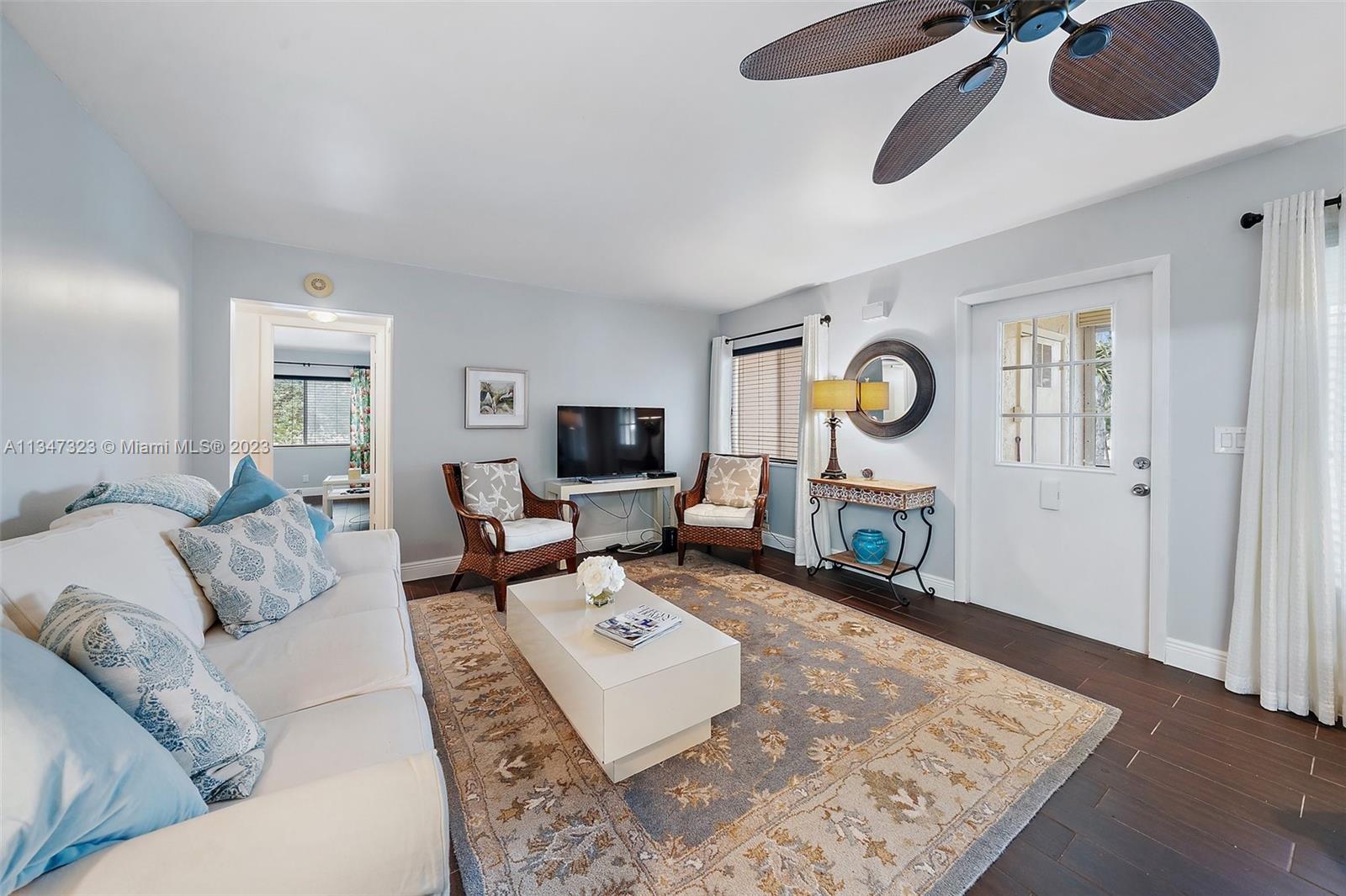 301 Pine Ridge Circle, Unit D2 Greenacres, FL 33463 - Photo 7 of 38 a living room with furniture rug and window