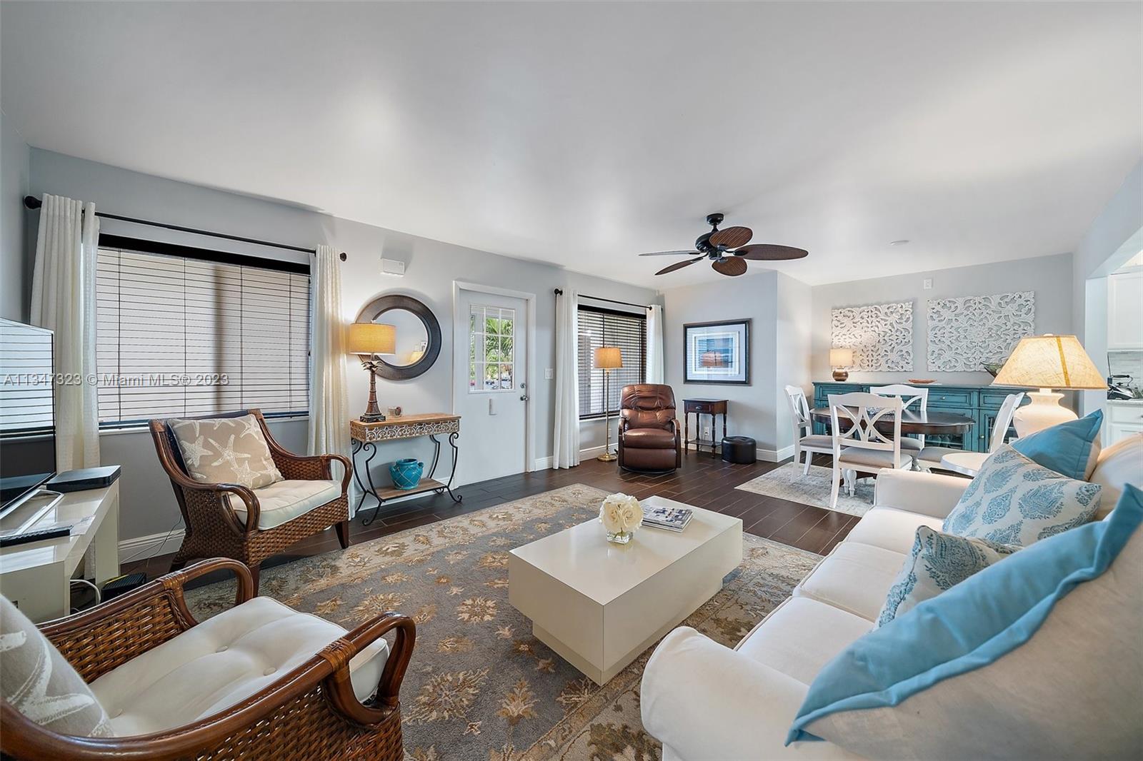 301 Pine Ridge Circle, Unit D2 Greenacres, FL 33463 - Photo 8 of 38 a living room with furniture and wooden floor