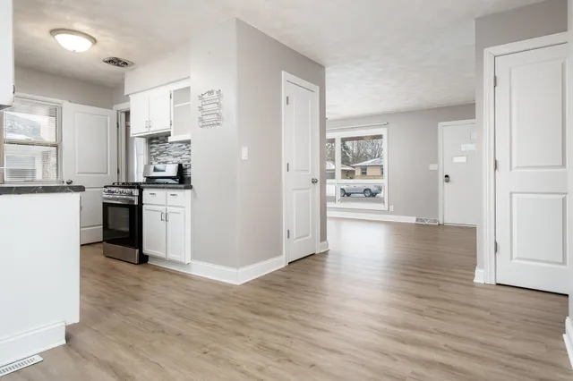 a bathroom with a toilet a sink and bathtub