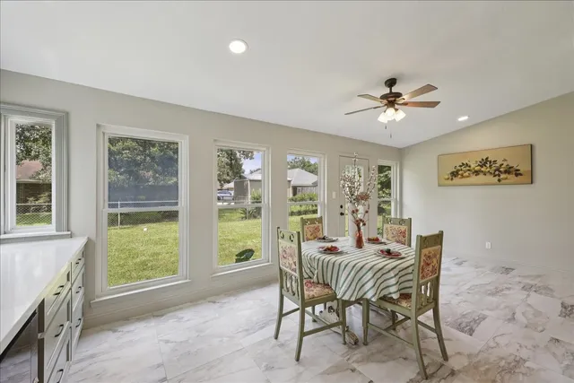a dining room with furniture and window