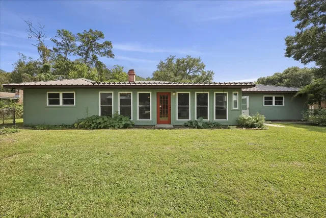 front view of a house with a yard