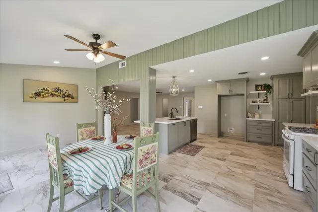 a very nice looking dining room with a large window