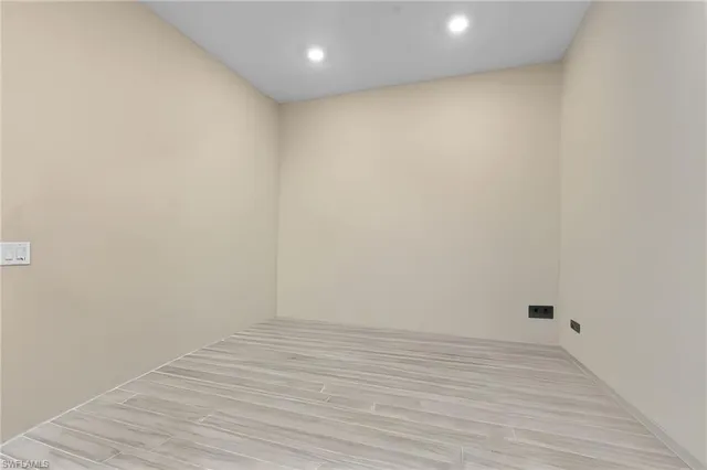 a view of room with wooden floor