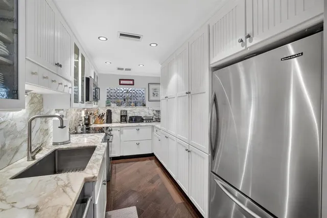 a spacious bathroom with a double vanity sink and a mirror