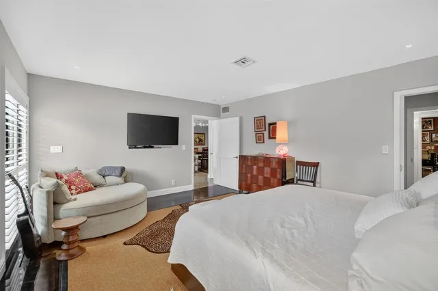 a view of balcony with chairs and potted plants