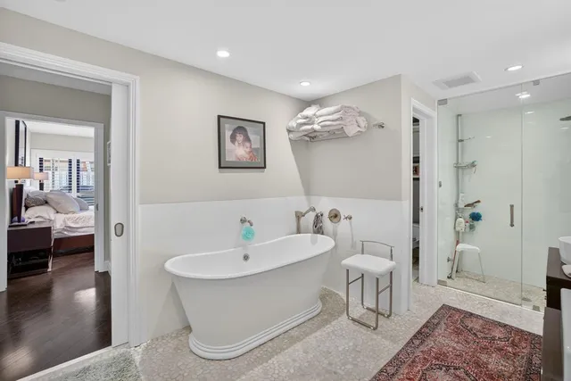 a spacious bathroom with a granite countertop sink and a window