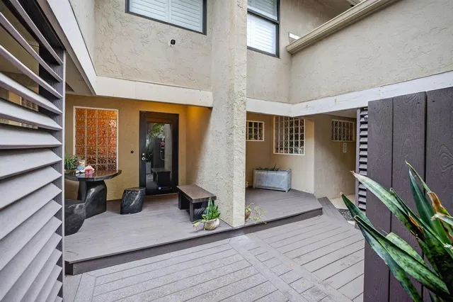 a living room with furniture and a lamp