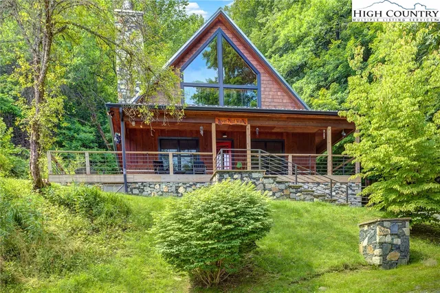 a view of house with backyard and garden