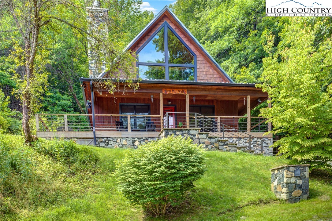 a view of house with backyard and garden