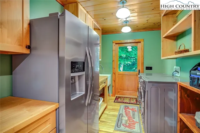 a living room with furniture a rug and a large window