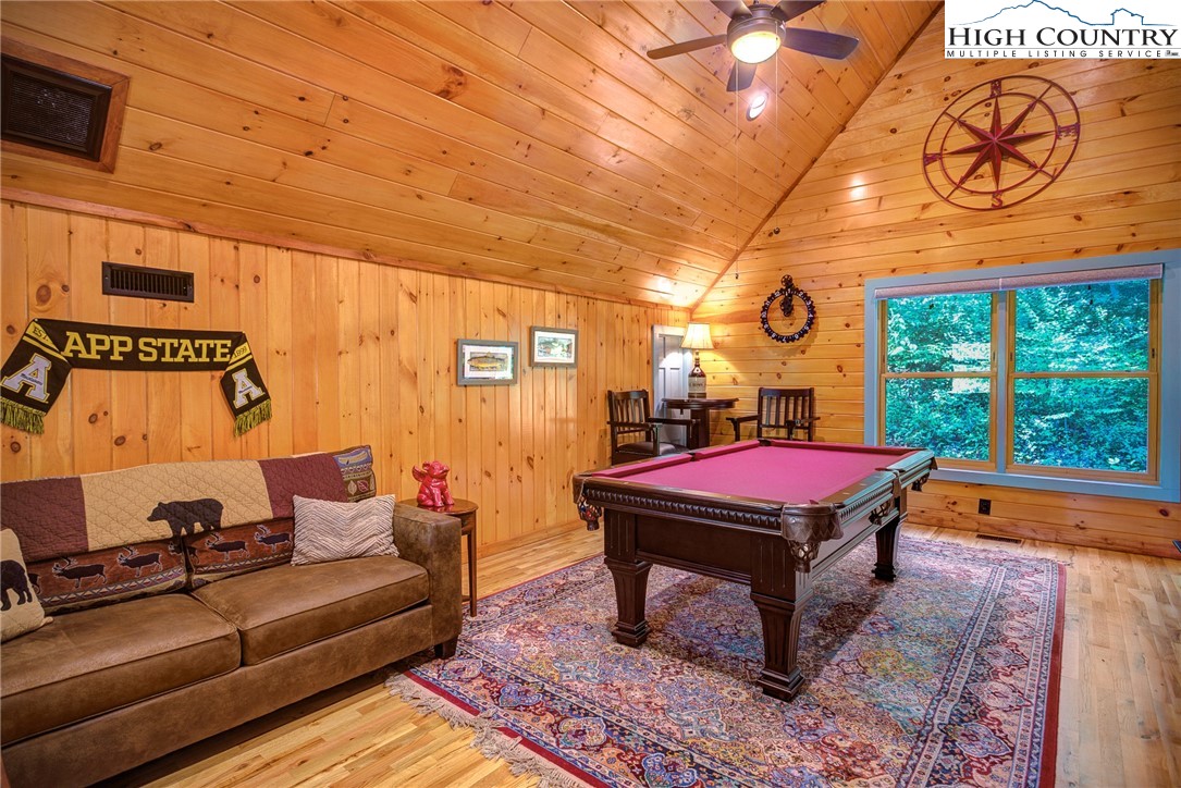 568 Auborn Trivette Road Sugar Grove, NC 28679 - Photo 19 of 29 a living room with furniture a rug and a large window