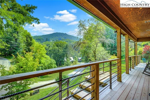 a view of a backyard with plants and a patio