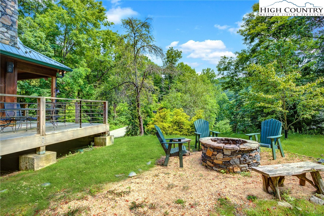 568 Auborn Trivette Road Sugar Grove, NC 28679 - Photo 24 of 29 a view of a backyard with plants and a patio