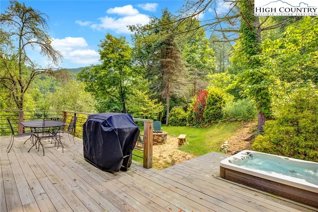 a view of backyard with seating area and green space