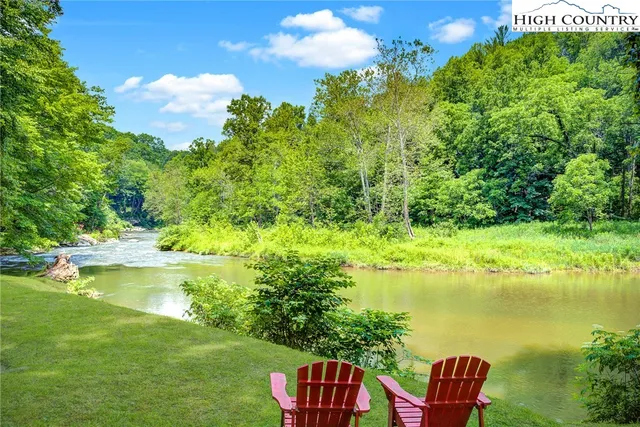 a view of a lake with a yard