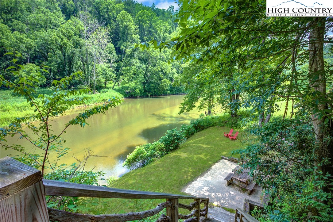 568 Auborn Trivette Road Sugar Grove, NC 28679 - Photo 28 of 29 a view of a lake with a yard