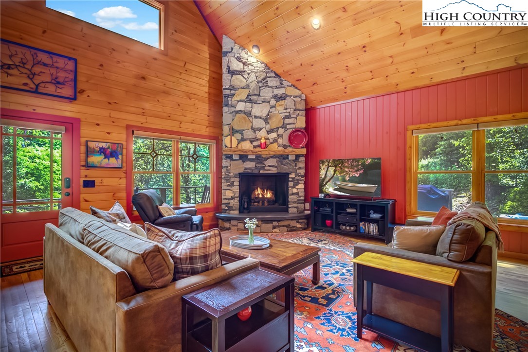 568 Auborn Trivette Road Sugar Grove, NC 28679 - Photo 7 of 29 a living room with fireplace furniture and a flat screen tv