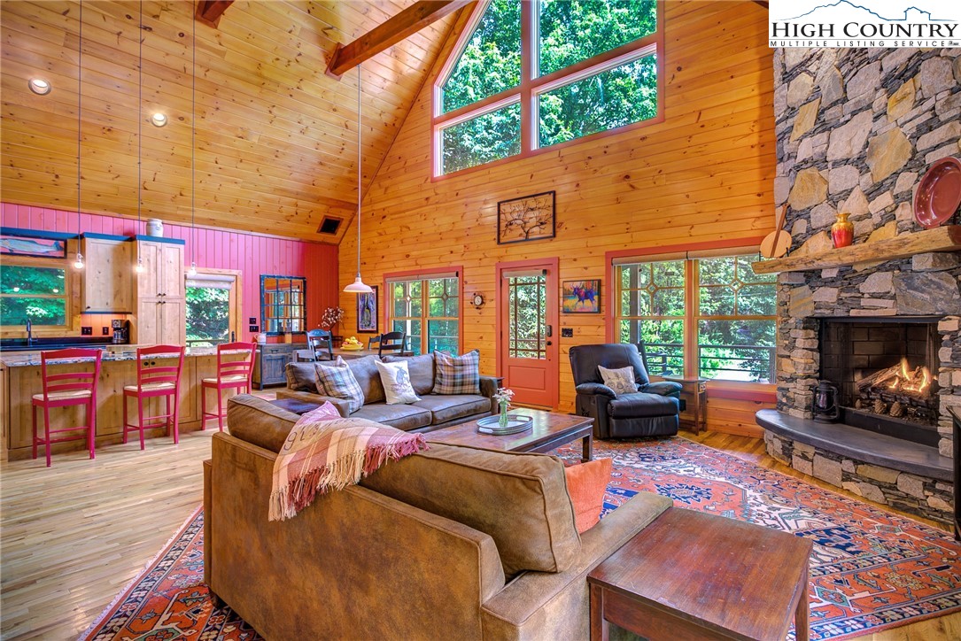 568 Auborn Trivette Road Sugar Grove, NC 28679 - Photo 8 of 29 a outdoor space with patio furniture and a fireplace