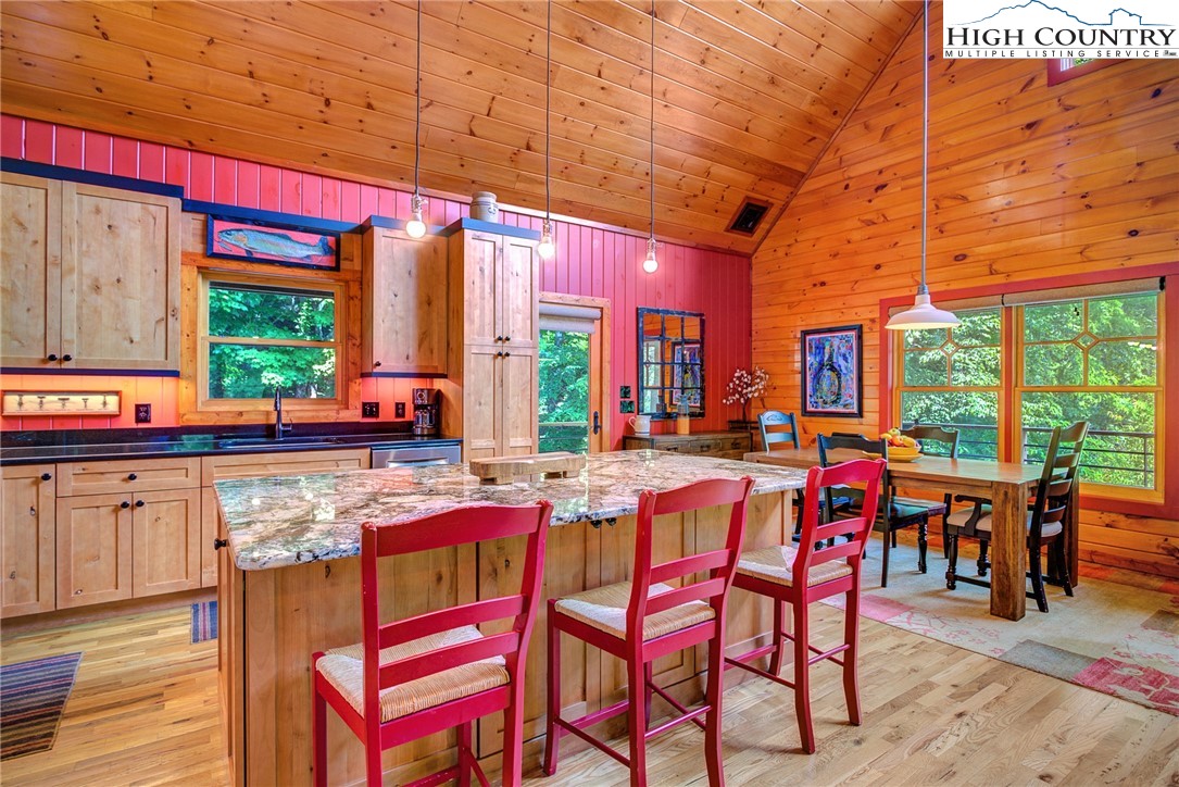 568 Auborn Trivette Road Sugar Grove, NC 28679 - Photo 10 of 29 a group of chairs sitting in a kitchen next to a large window