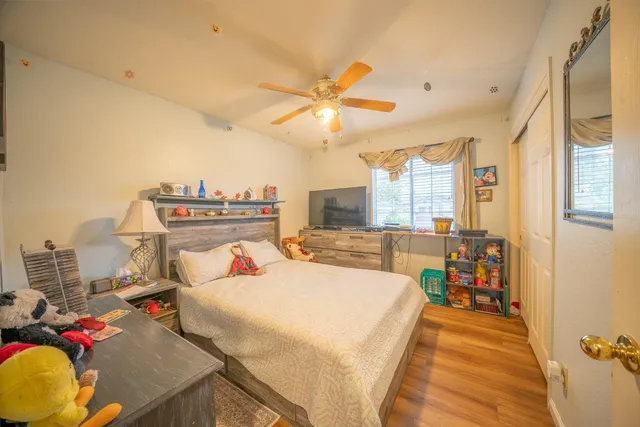 a bed room with a bed and a chandelier