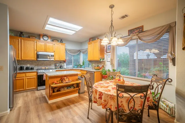 a view of a dining room with furniture and window