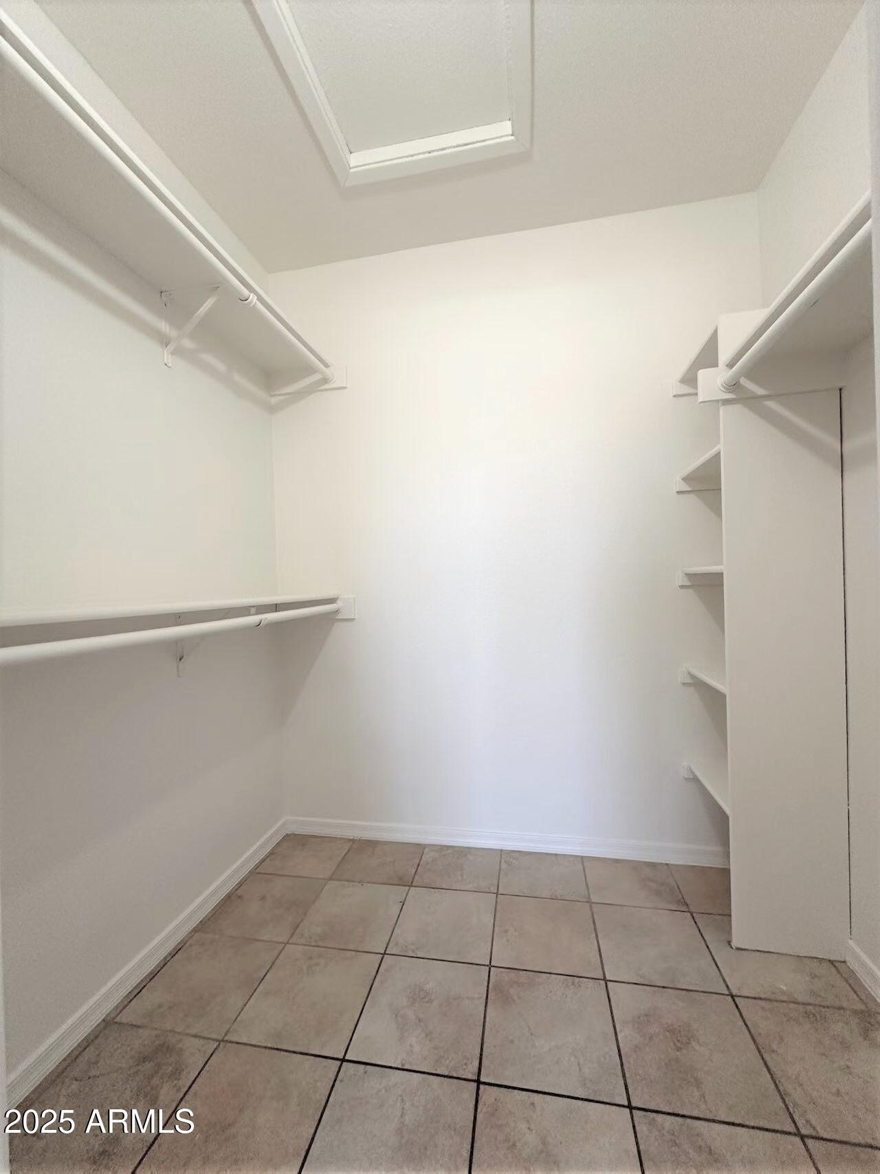 3511 East Baseline Road, Unit 1049 Phoenix, AZ 85042 - Photo 7 of 10 a view of an empty walk in closet