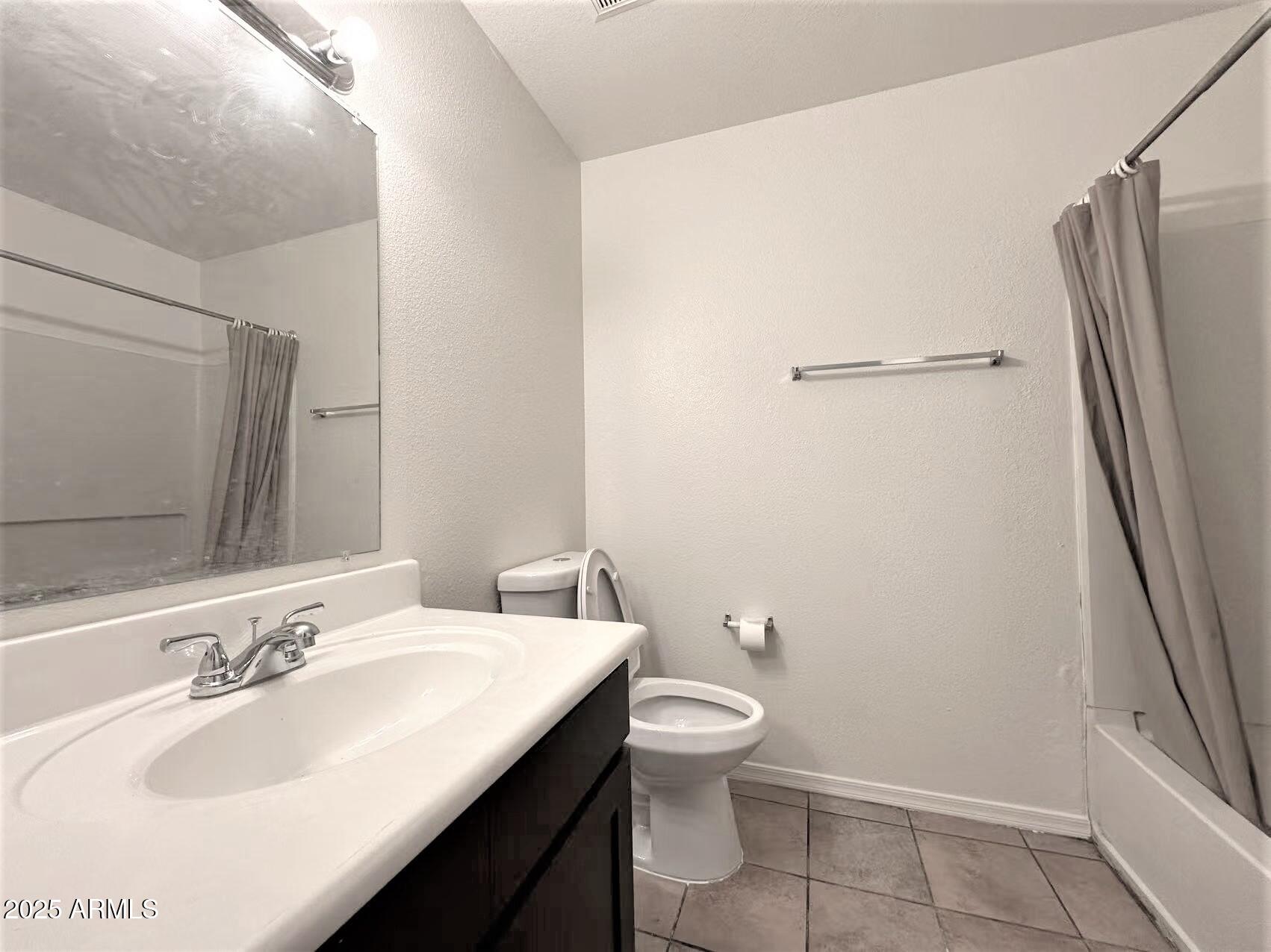 3511 East Baseline Road, Unit 1049 Phoenix, AZ 85042 - Photo 9 of 10 a bathroom with a sink toilet and shower