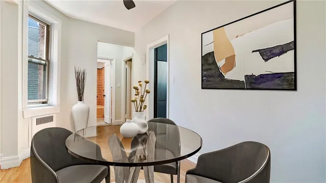 a dining room with furniture and window