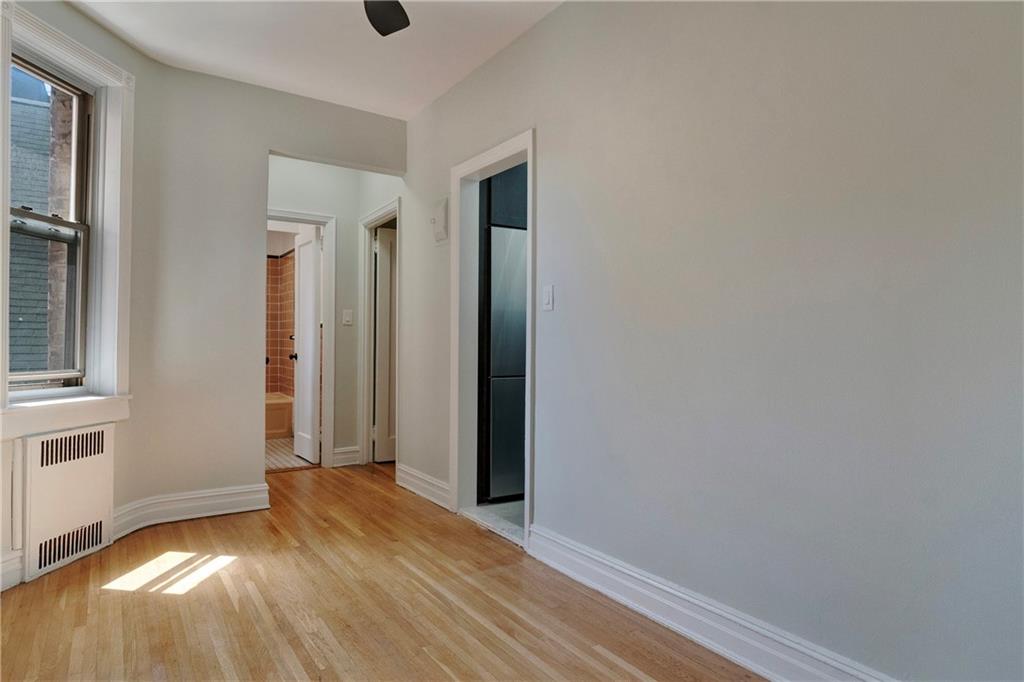 1560 East 18th Street, Unit 3D Brooklyn, NY 11230 - Photo 7 of 10 wooden floor in an empty room