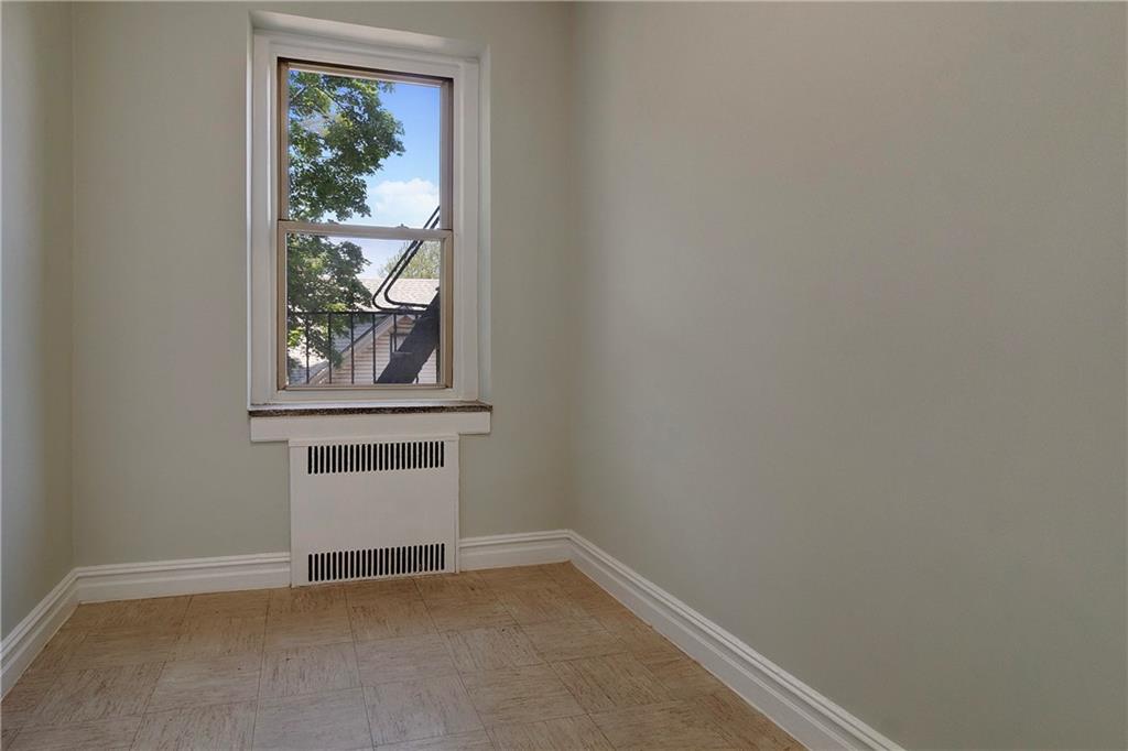 1560 East 18th Street, Unit 3D Brooklyn, NY 11230 - Photo 8 of 10 an empty room with windows