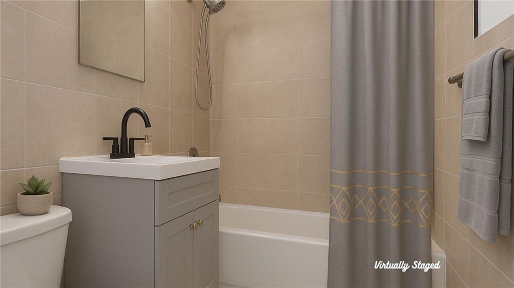 1560 East 18th Street, Unit 3D Brooklyn, NY 11230 - Photo 10 of 10 a bathroom with a sink a toilet and shower