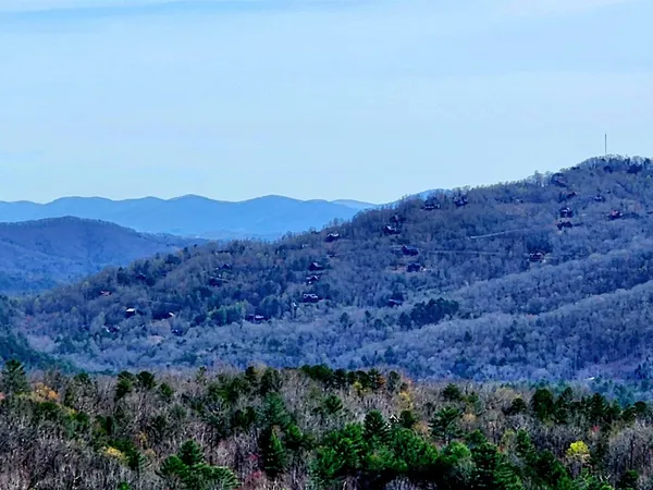 a view of mountains and valleys