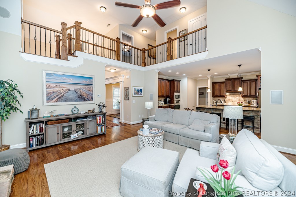 78 Spring Pond Lane Spring Lake, NC 28390 - Photo 13 of 46 a living room with furniture kitchen view and a chandelier