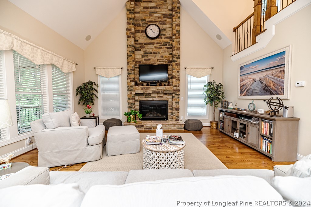 78 Spring Pond Lane Spring Lake, NC 28390 - Photo 16 of 46 a living room with furniture a flat screen tv and a fireplace