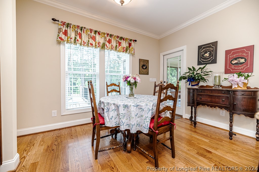 78 Spring Pond Lane Spring Lake, NC 28390 - Photo 19 of 46 a dining room with furniture and wooden floor