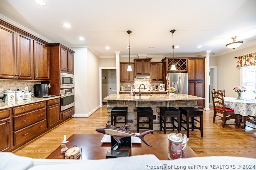 78 Spring Pond Lane Spring Lake, NC 28390 - Photo 22 of 46 a large kitchen with lots of counter space and furniture