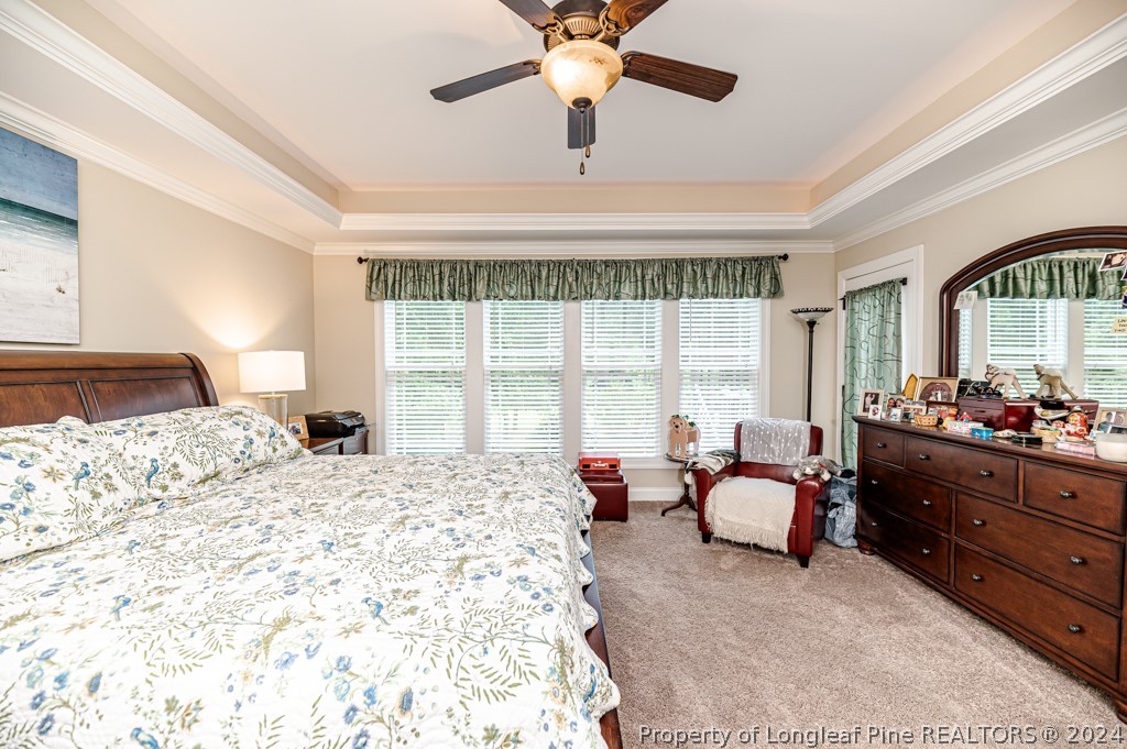 78 Spring Pond Lane Spring Lake, NC 28390 - Photo 23 of 46 a spacious bedroom with a bed and a large window