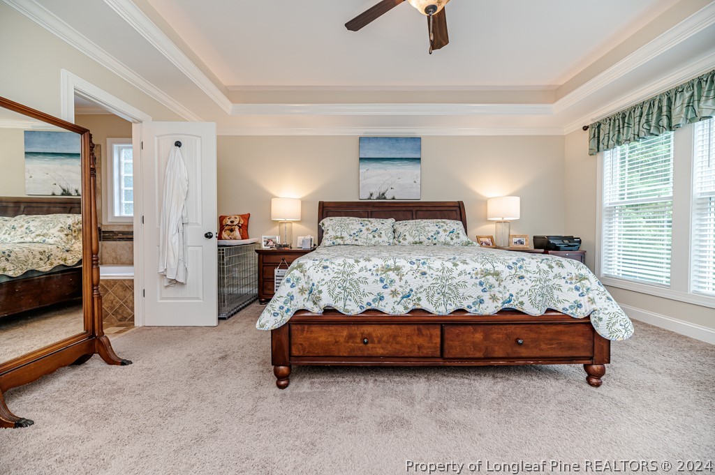 78 Spring Pond Lane Spring Lake, NC 28390 - Photo 25 of 46 a bed sitting in a bedroom next to a window