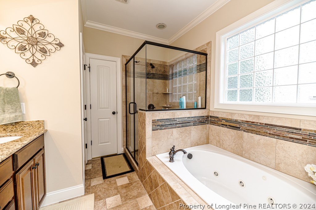 78 Spring Pond Lane Spring Lake, NC 28390 - Photo 27 of 46 a bathroom with a bathtub and a shower