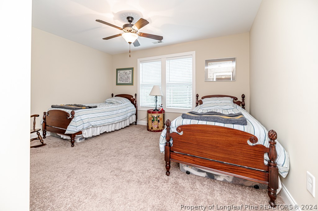 78 Spring Pond Lane Spring Lake, NC 28390 - Photo 28 of 46 a bedroom with furniture and a window