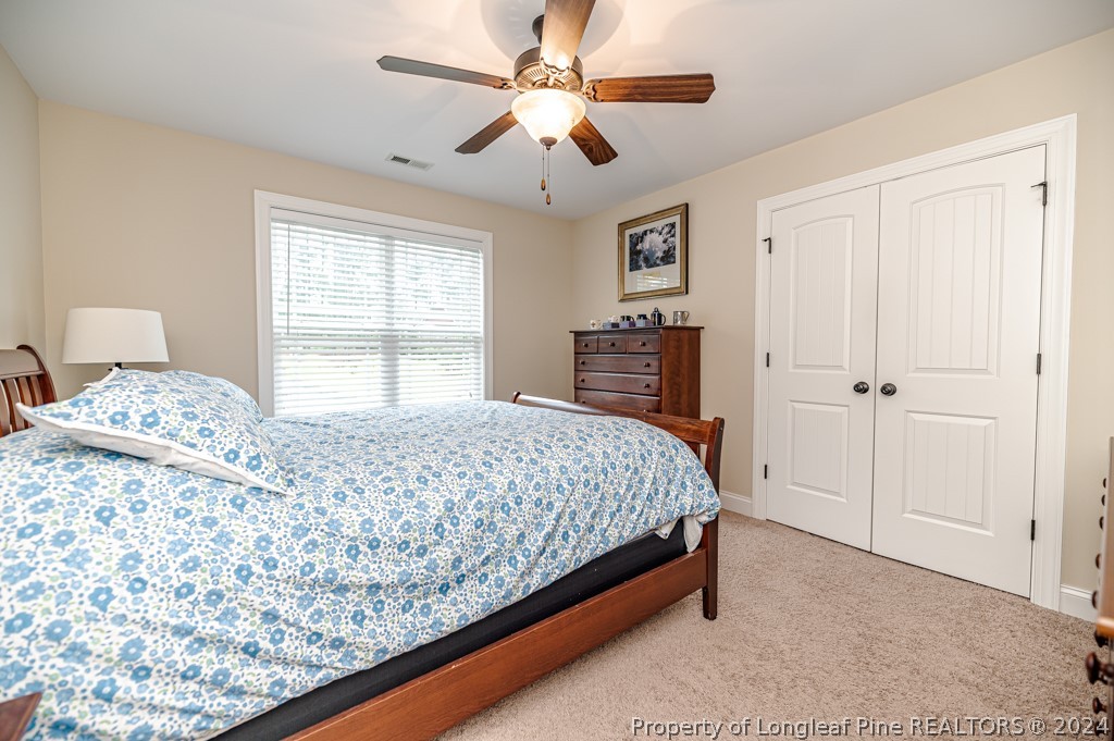 78 Spring Pond Lane Spring Lake, NC 28390 - Photo 31 of 46 a bedroom with a bed and a window