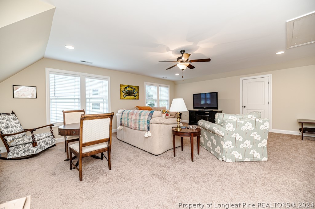 78 Spring Pond Lane Spring Lake, NC 28390 - Photo 33 of 46 a living room with furniture and a flat screen tv