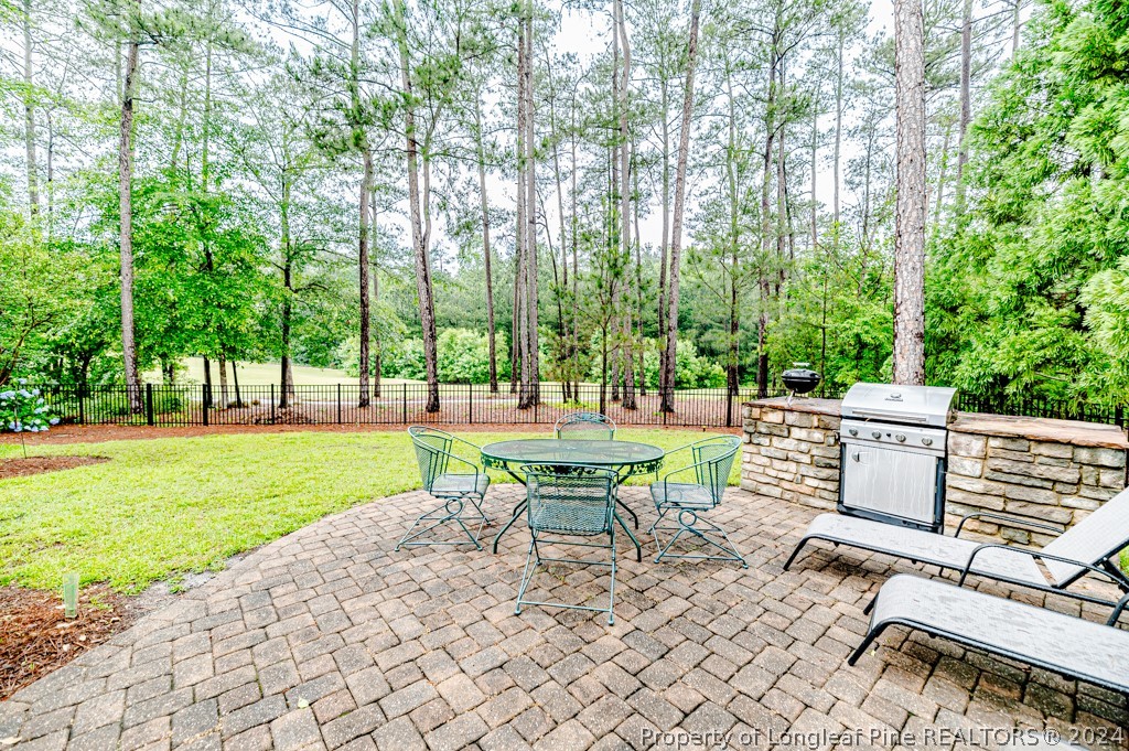 78 Spring Pond Lane Spring Lake, NC 28390 - Photo 42 of 46 a view of a patio with a backyard