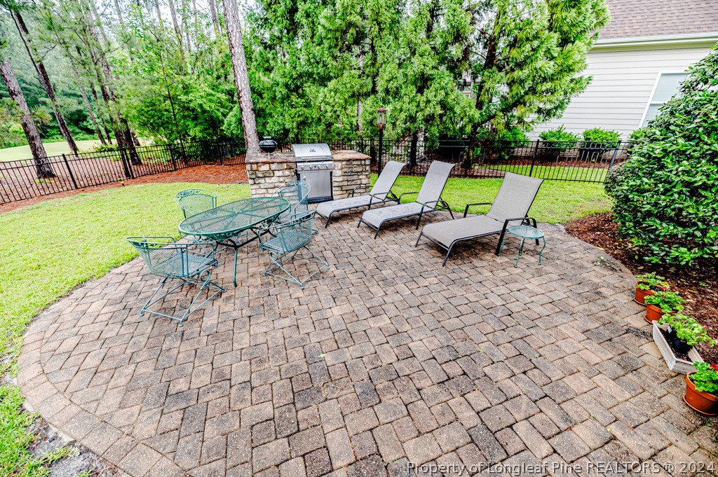 78 Spring Pond Lane Spring Lake, NC 28390 - Photo 44 of 46 a view of a backyard with swimming pool