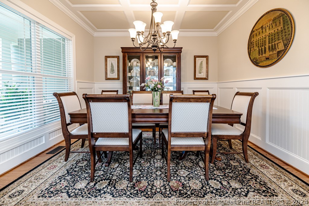 78 Spring Pond Lane Spring Lake, NC 28390 - Photo 9 of 46 a view of a dining room with furniture and chandelier