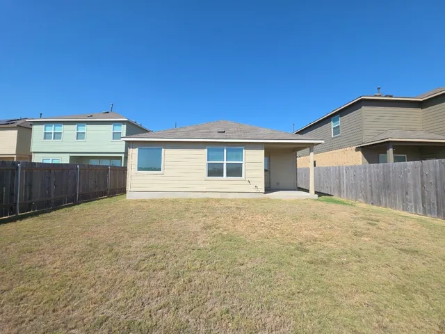 a house with yard in front of it